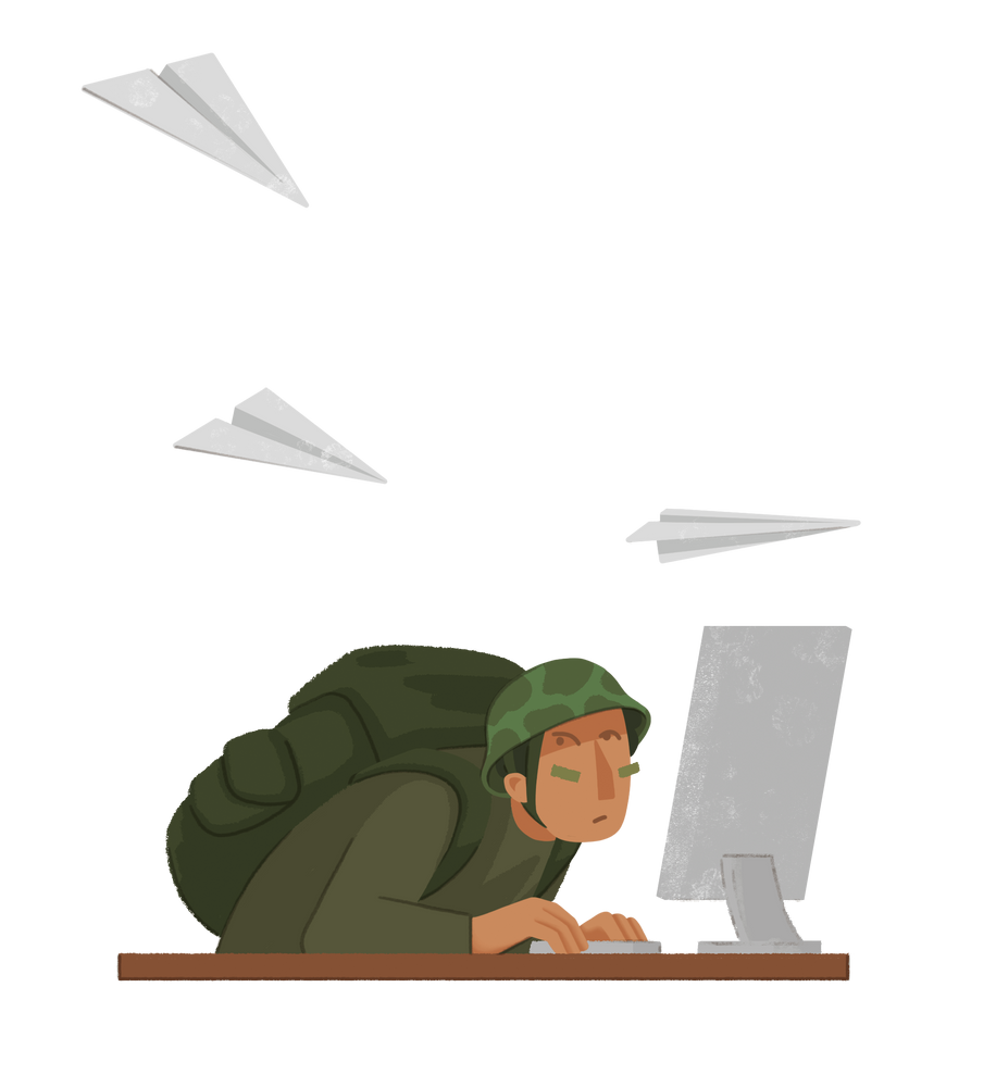 Eine Person in militärischer Kleidung, die sich hinterm Monitor vor Papierfliegern versteckt