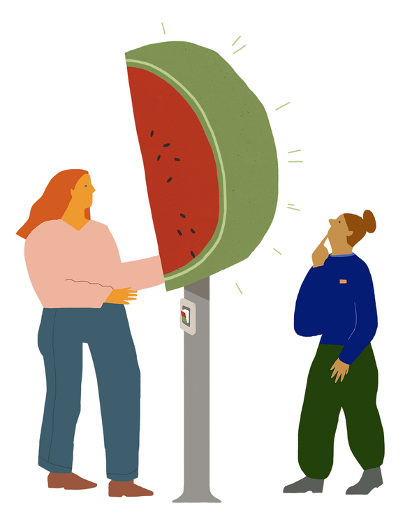 Eine Ampel mit einer Melone oben drauf